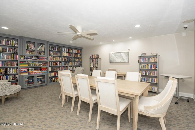 dining area with carpet floors and ceiling fan