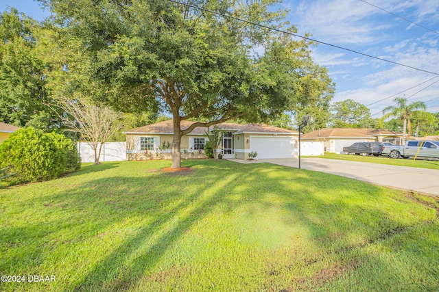 single story home with a garage and a front lawn