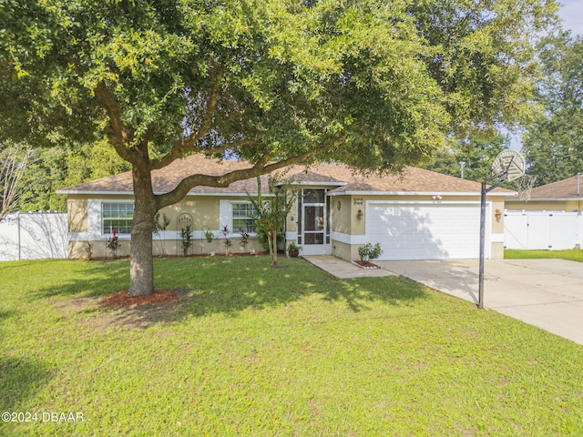 view of front of house featuring a garage and a front lawn