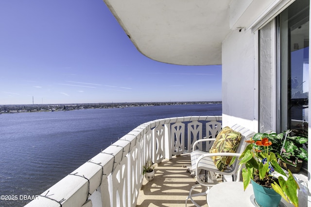 balcony featuring a water view