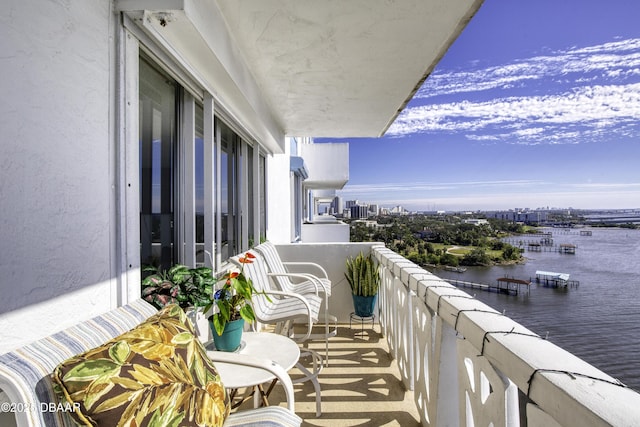 balcony featuring a water view