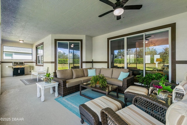 view of patio featuring ceiling fan and an outdoor living space