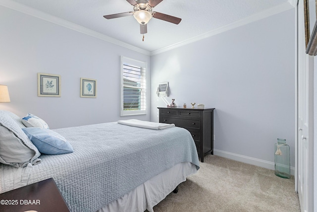 bedroom featuring light carpet, crown molding, and ceiling fan