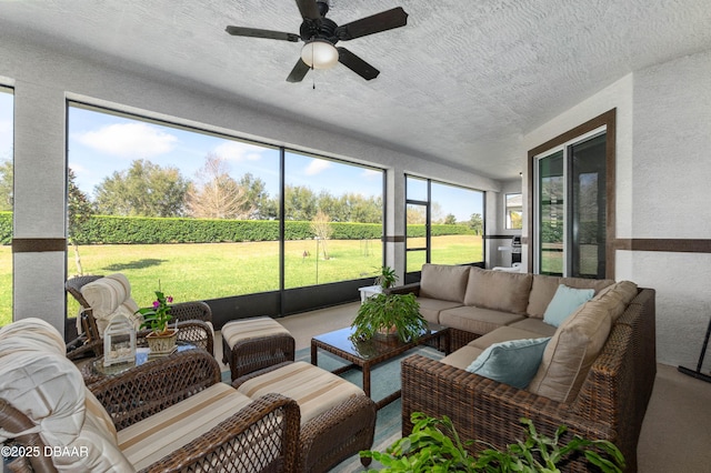 sunroom with ceiling fan