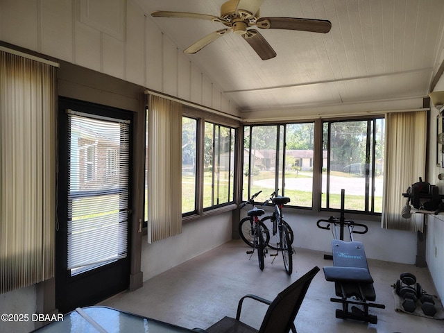 sunroom featuring plenty of natural light and vaulted ceiling