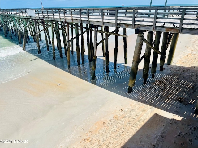 exterior space with a beach view and a water view