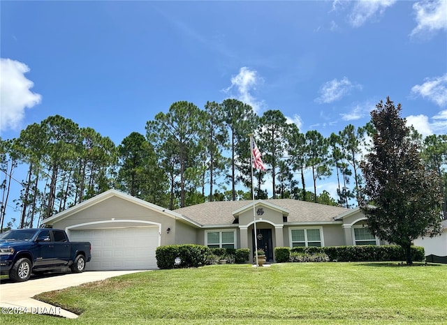 ranch-style house featuring a front lawn and a garage