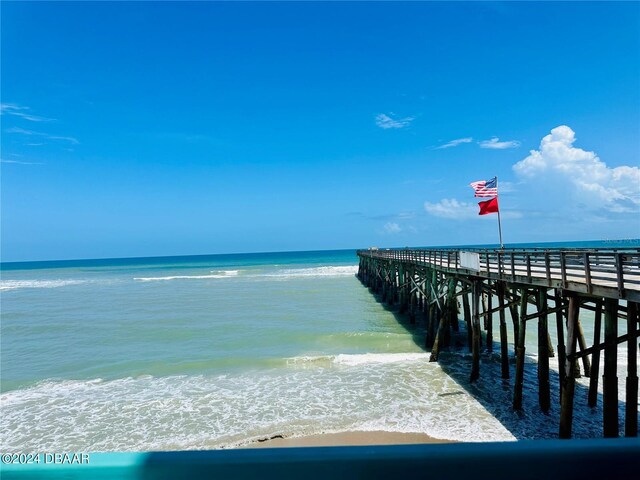 dock area with a view of the beach and a water view