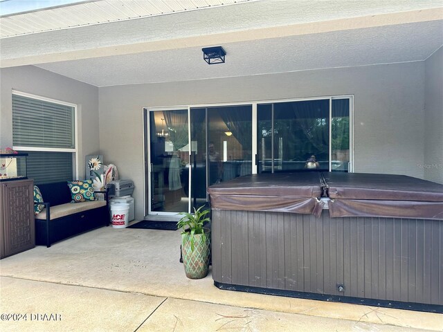 view of patio with a hot tub