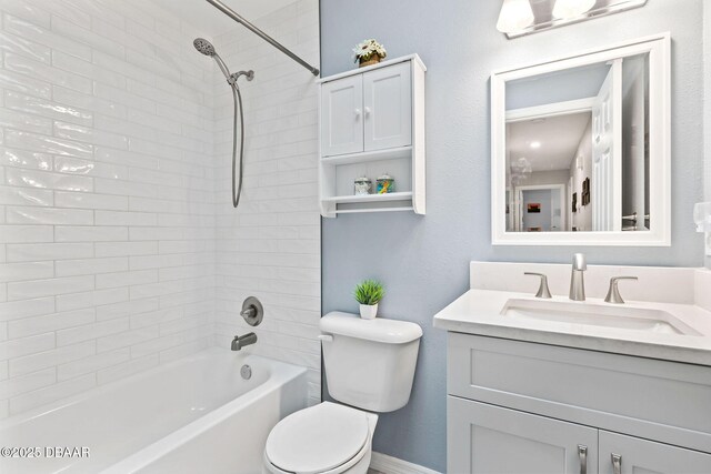 1317 Dexter Dr W, Port Orange, FL 32129 - bathroom with vanity, toilet, washtub / shower combination, and baseboards