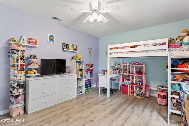 1317 Dexter Dr W, Port Orange, FL 32129 - bedroom featuring light wood-type flooring, ceiling fan, and baseboards