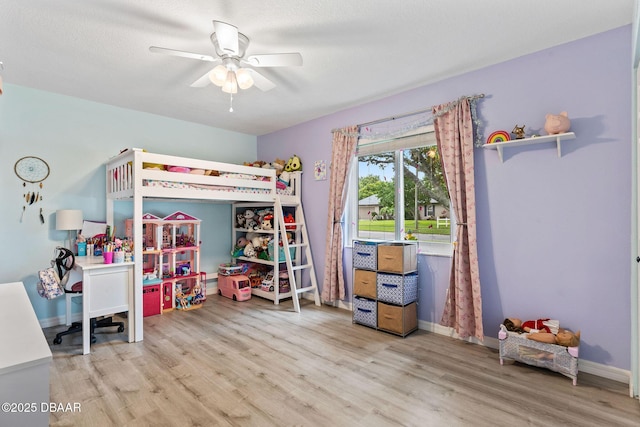 1317 Dexter Dr W, Port Orange, FL 32129 - bedroom with wood finished floors, ceiling fan, and baseboards