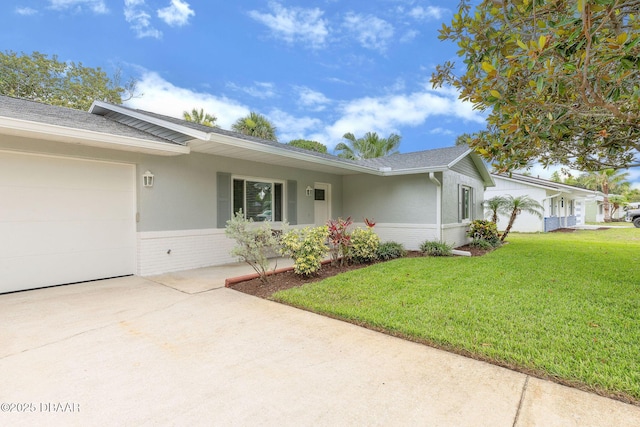 1317 Dexter Dr W, Port Orange, FL 32129 - view of front of home with driveway, an attached garage, a front lawn, brick siding, and stucco siding