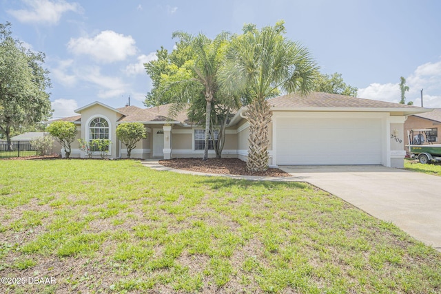 ranch-style home with a front yard and a garage