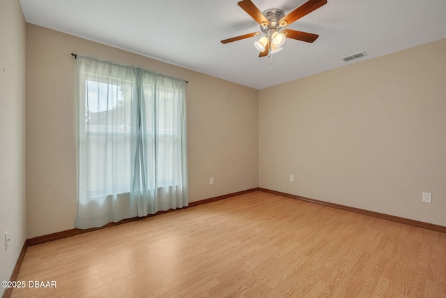 unfurnished room featuring ceiling fan and light wood-type flooring