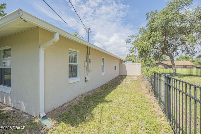 view of home's exterior featuring a yard