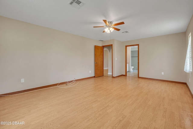 spare room featuring ceiling fan and light wood-type flooring