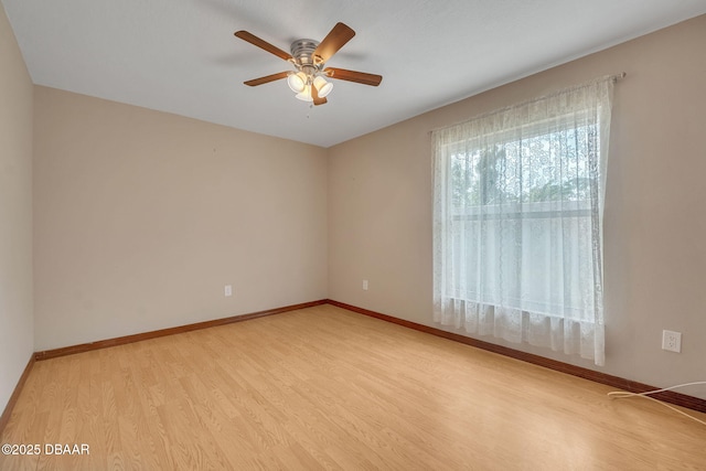 spare room featuring ceiling fan and wood-type flooring