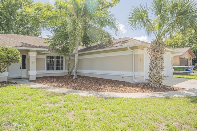 view of property exterior with a yard and a garage