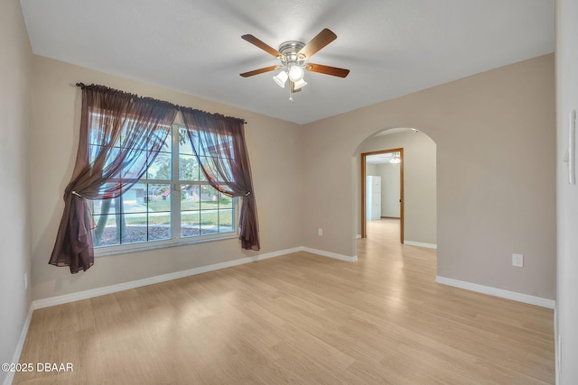 spare room with ceiling fan and light hardwood / wood-style floors