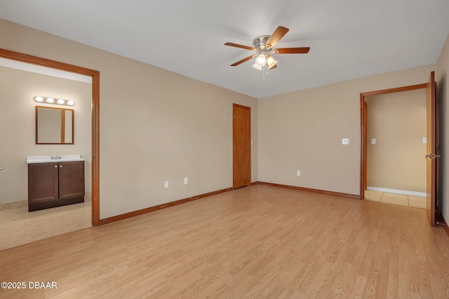 spare room with light hardwood / wood-style floors and ceiling fan