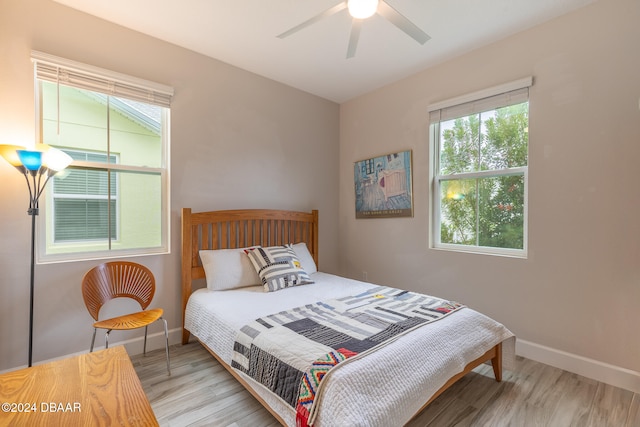 bedroom featuring light hardwood / wood-style floors and ceiling fan