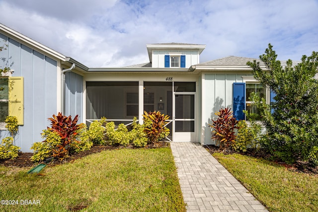 entrance to property with a yard