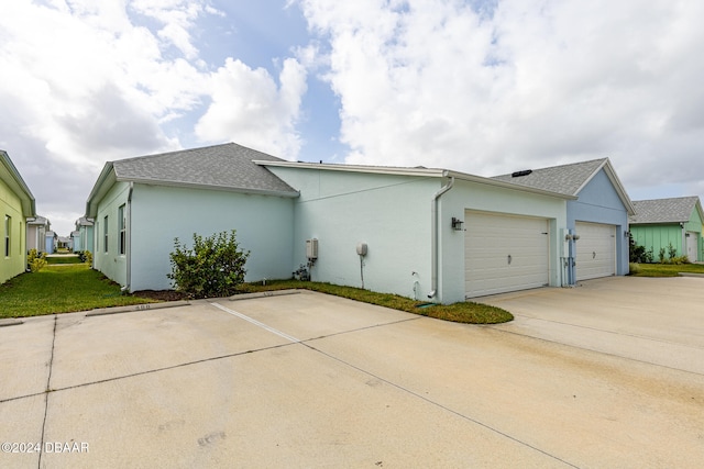 view of side of home featuring a garage