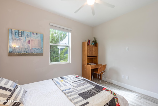 bedroom with light hardwood / wood-style floors and ceiling fan