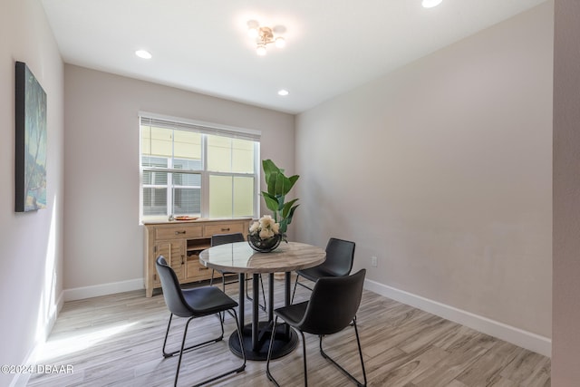 dining space with light wood-type flooring