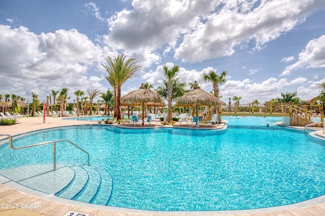 pool featuring a patio and a gazebo