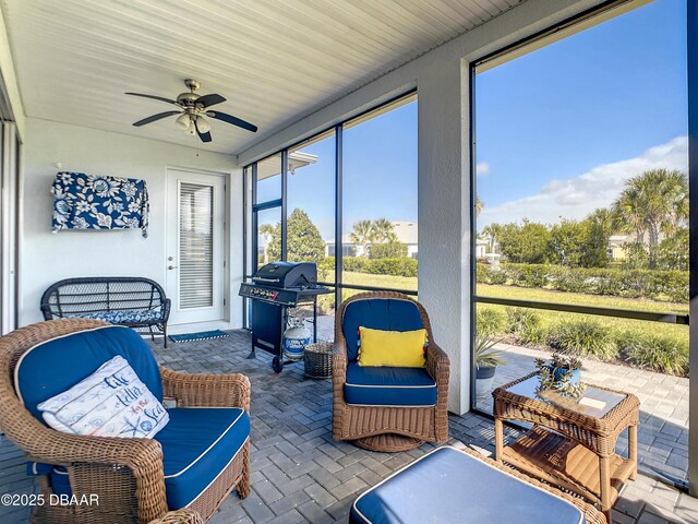 sunroom / solarium with ceiling fan