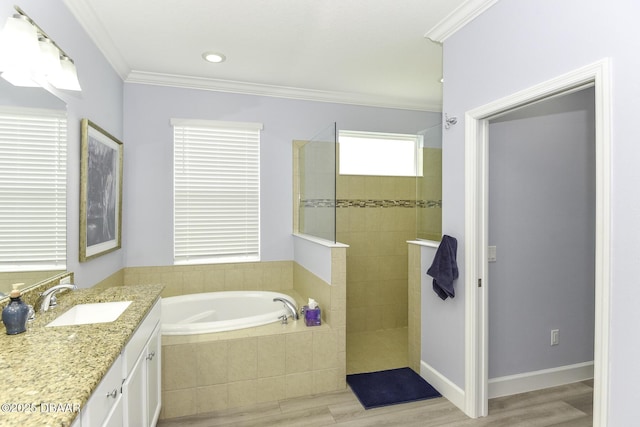 full bath featuring vanity, ornamental molding, wood finished floors, a walk in shower, and a bath