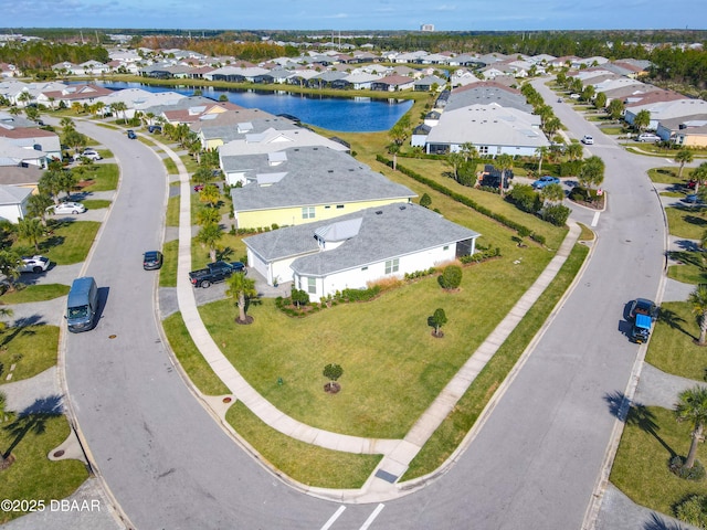 birds eye view of property featuring a residential view and a water view