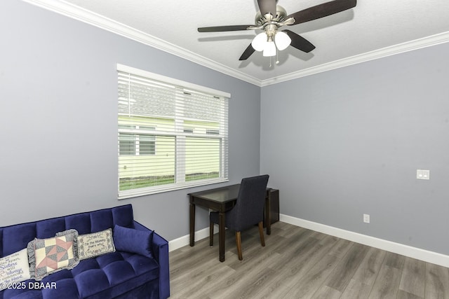 home office with baseboards, ornamental molding, a ceiling fan, and wood finished floors