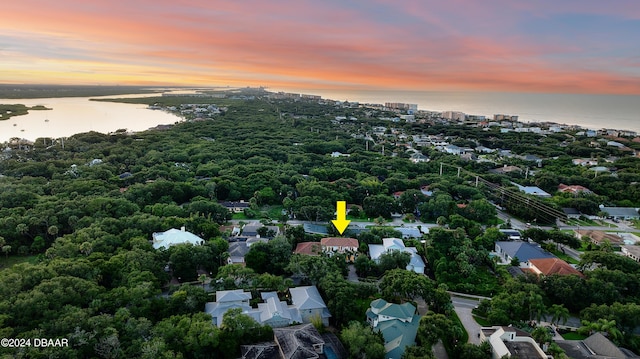 aerial view at dusk with a water view