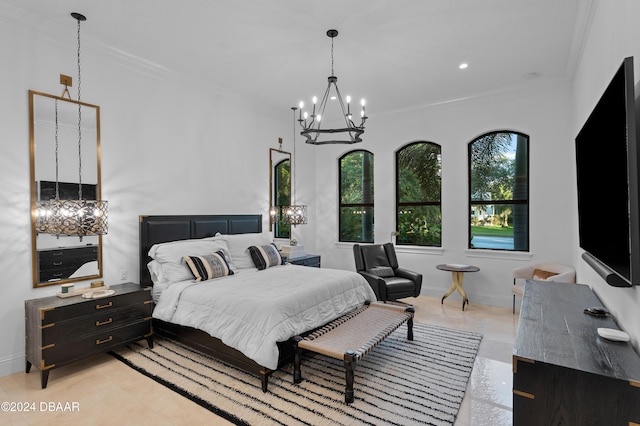 bedroom featuring crown molding and a chandelier