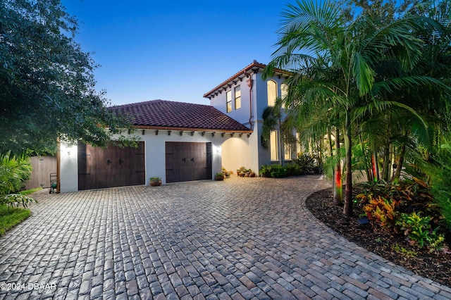 mediterranean / spanish-style house featuring a garage