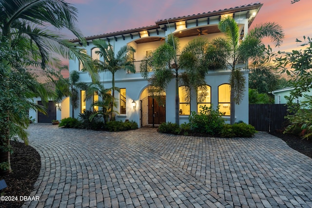 mediterranean / spanish home with a balcony