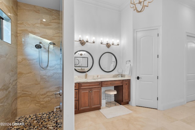 bathroom with vanity, crown molding, and walk in shower