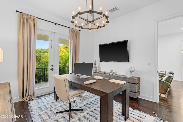 office with dark wood-type flooring and french doors