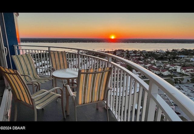 balcony at dusk with a water view