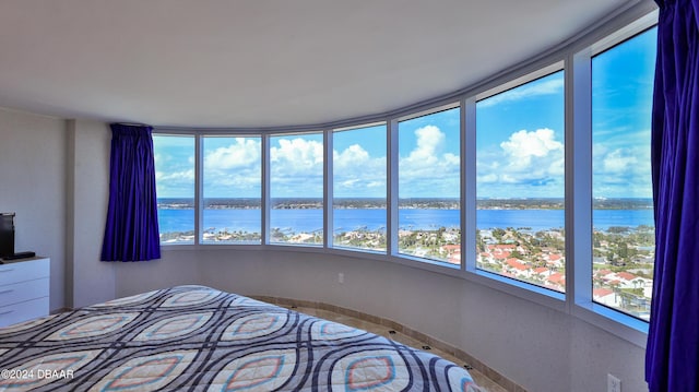 2625 S Atlantic Ave Unit 24Nw, Daytona Beach Shores, FL 32118 - bedroom featuring a water view and multiple windows