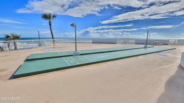 2625 S Atlantic Ave Unit 24Nw, Daytona Beach Shores, FL 32118 - surrounding community with shuffleboard, a water view, and fence
