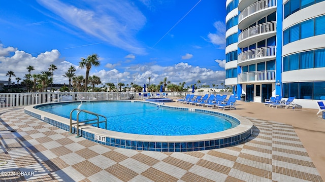 view of swimming pool featuring a patio area