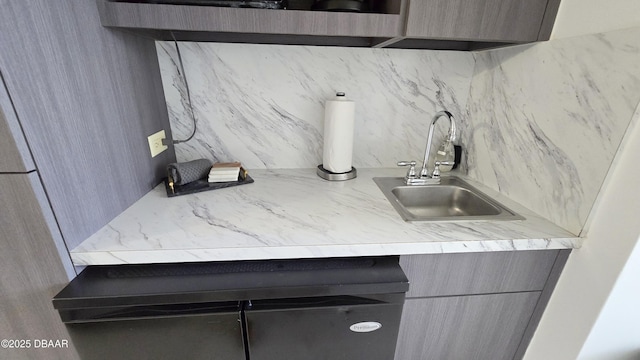 kitchen featuring decorative backsplash and sink