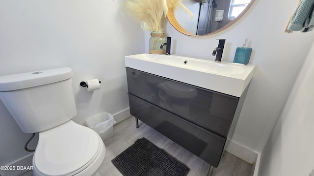 bathroom with toilet and vanity