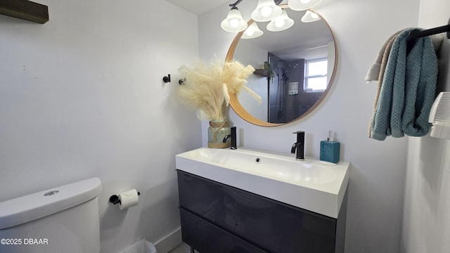 bathroom with toilet and vanity