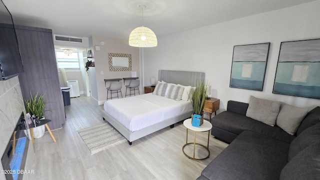 bedroom featuring light wood-type flooring