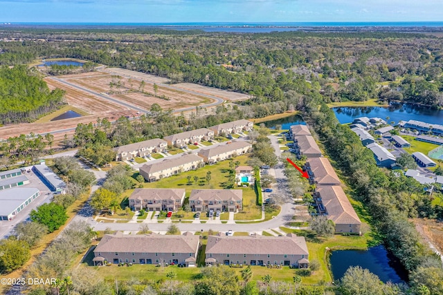 bird's eye view with a residential view and a water view